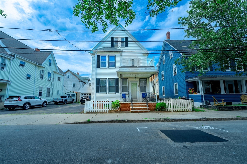 a front view of a building with garden