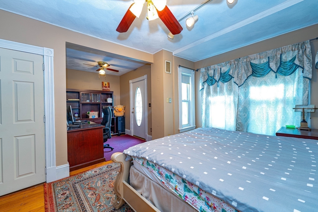 96 Clark Street Everett, MA 02149 - Photo 13 of 26 a bedroom with a bed and window