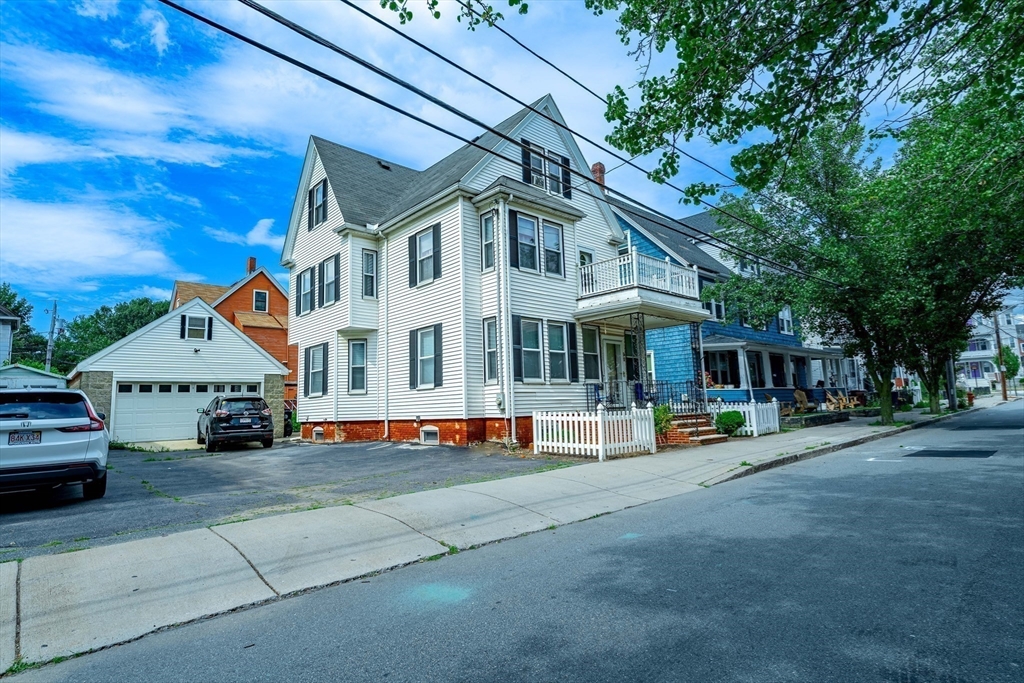 96 Clark Street Everett, MA 02149 - Photo 2 of 26 a view of house with outdoor space and sitting area