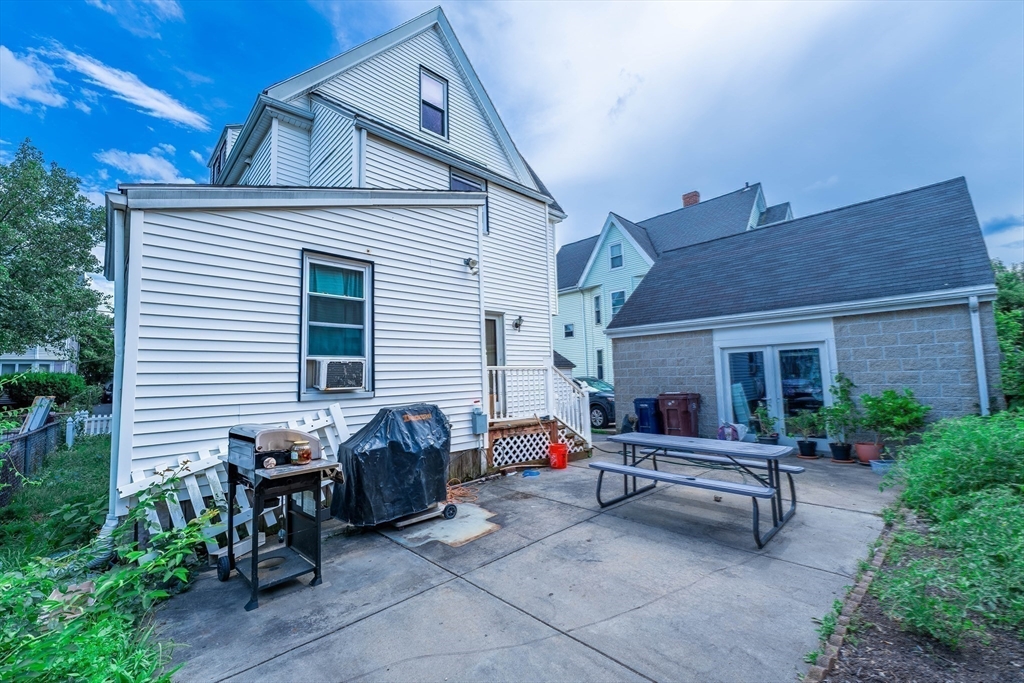 96 Clark Street Everett, MA 02149 - Photo 21 of 26 a house view with a sitting space and garden