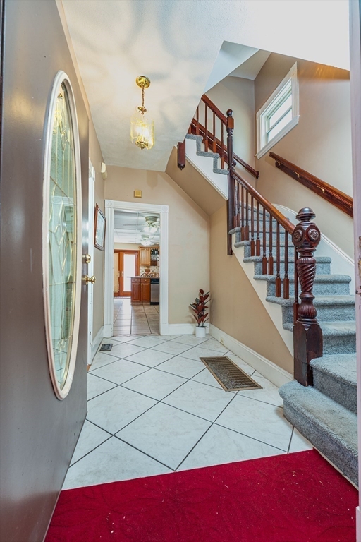96 Clark Street Everett, MA 02149 - Photo 4 of 26 a view of a livingroom with furniture and entryway