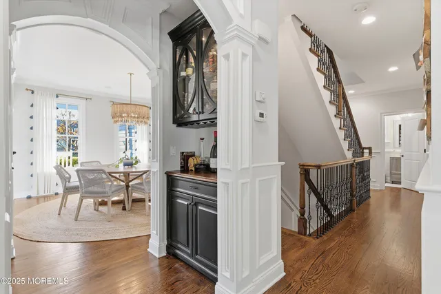 a kitchen with stainless steel appliances a sink stove and wooden cabinets