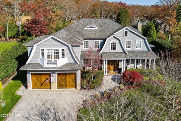 a kitchen with stainless steel appliances granite countertop a stove a sink dishwasher and a microwave with wooden floor