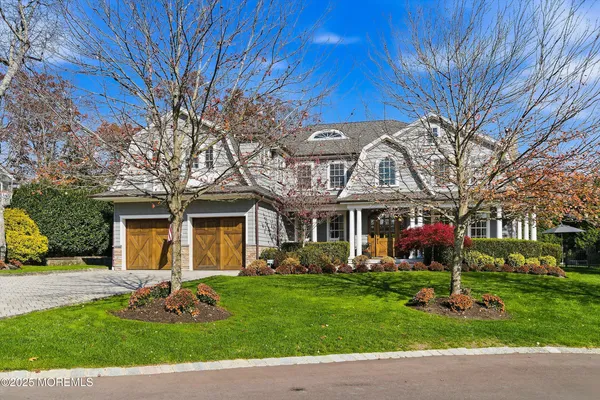 a bedroom with a large bed couch and a window