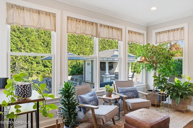 a bathroom with a sink mirror and a shower