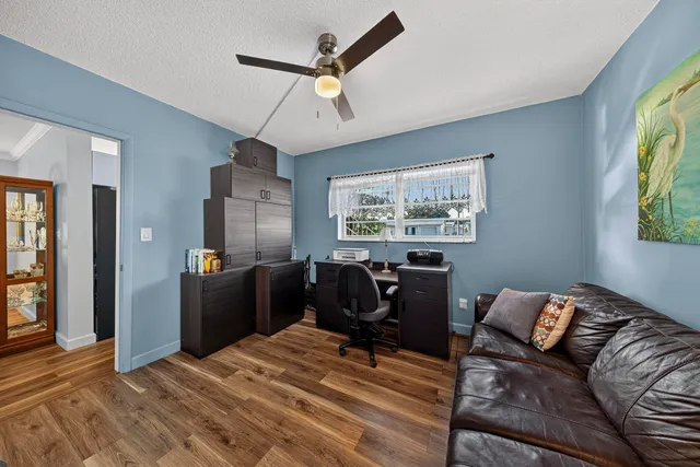 a view of a swimming pool with an outdoor seating and a lots of residential buildings