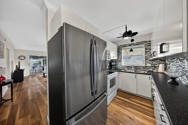 a dining room with furniture and a chandelier