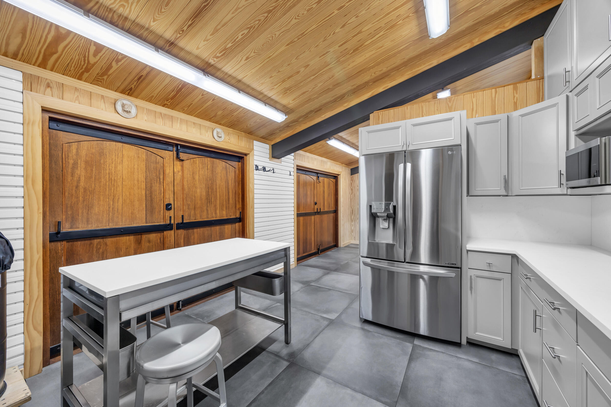 12880 Indian Mound Road Wellington, FL 33449 - Photo 15 of 43 a kitchen with a table and chairs