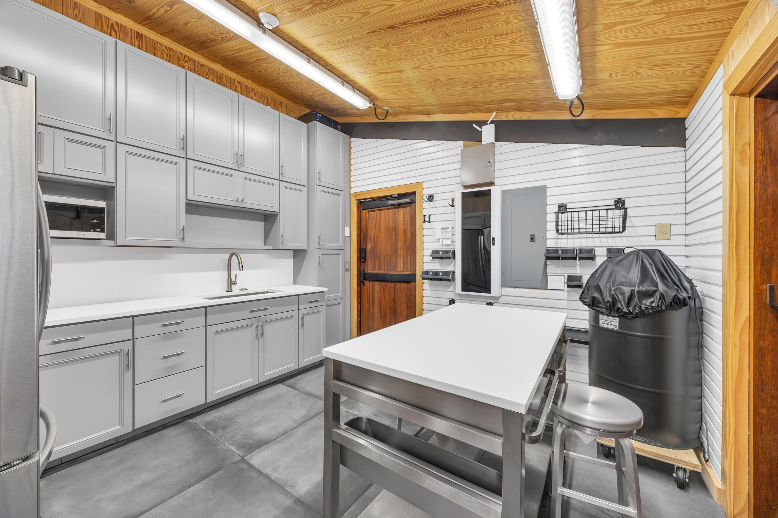 12880 Indian Mound Road Wellington, FL 33449 - Photo 16 of 43 a kitchen with a sink cabinets and appliances
