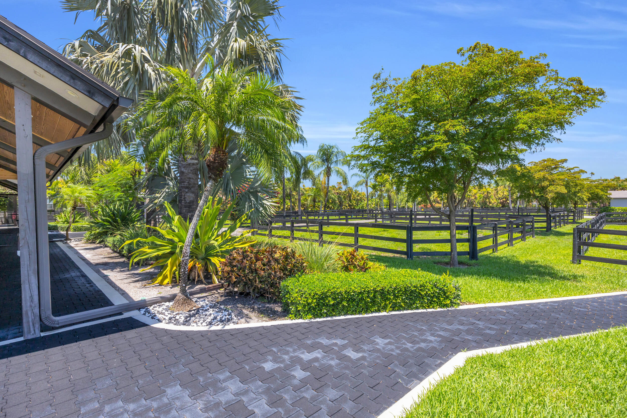 12880 Indian Mound Road Wellington, FL 33449 - Photo 22 of 43 a view of a garden with large trees