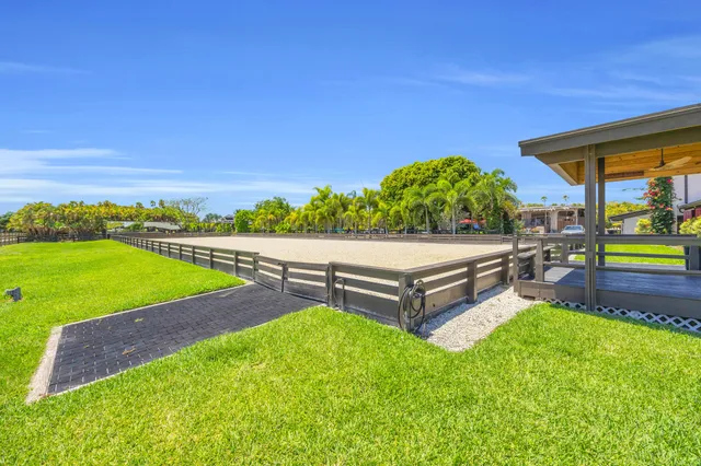 an aerial view of a residential apartment building with swimming pool