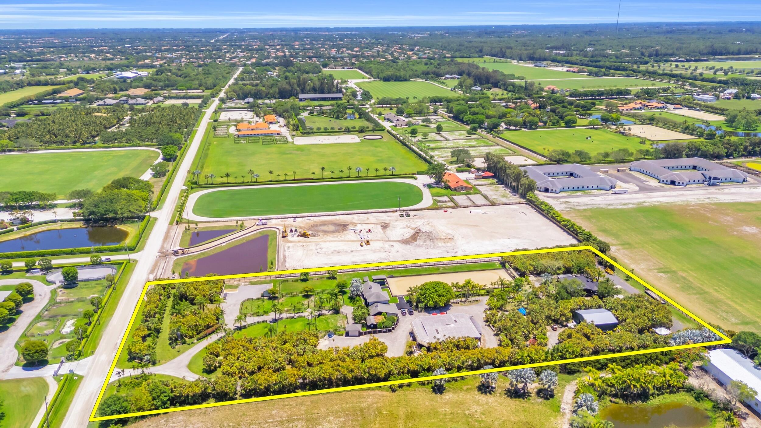 12880 Indian Mound Road Wellington, FL 33449 - Photo 35 of 43 an aerial view of a tennis ground and a houses