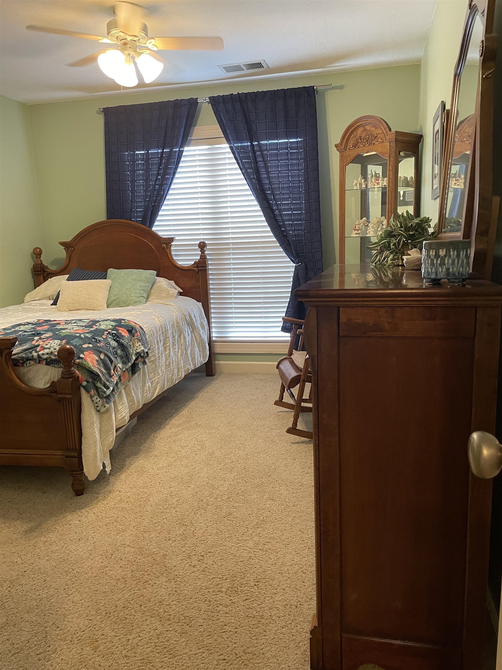 17 Flagstone Drive Jackson, TN 38305 - Photo 14 of 16 a bedroom with a bed and a dresser