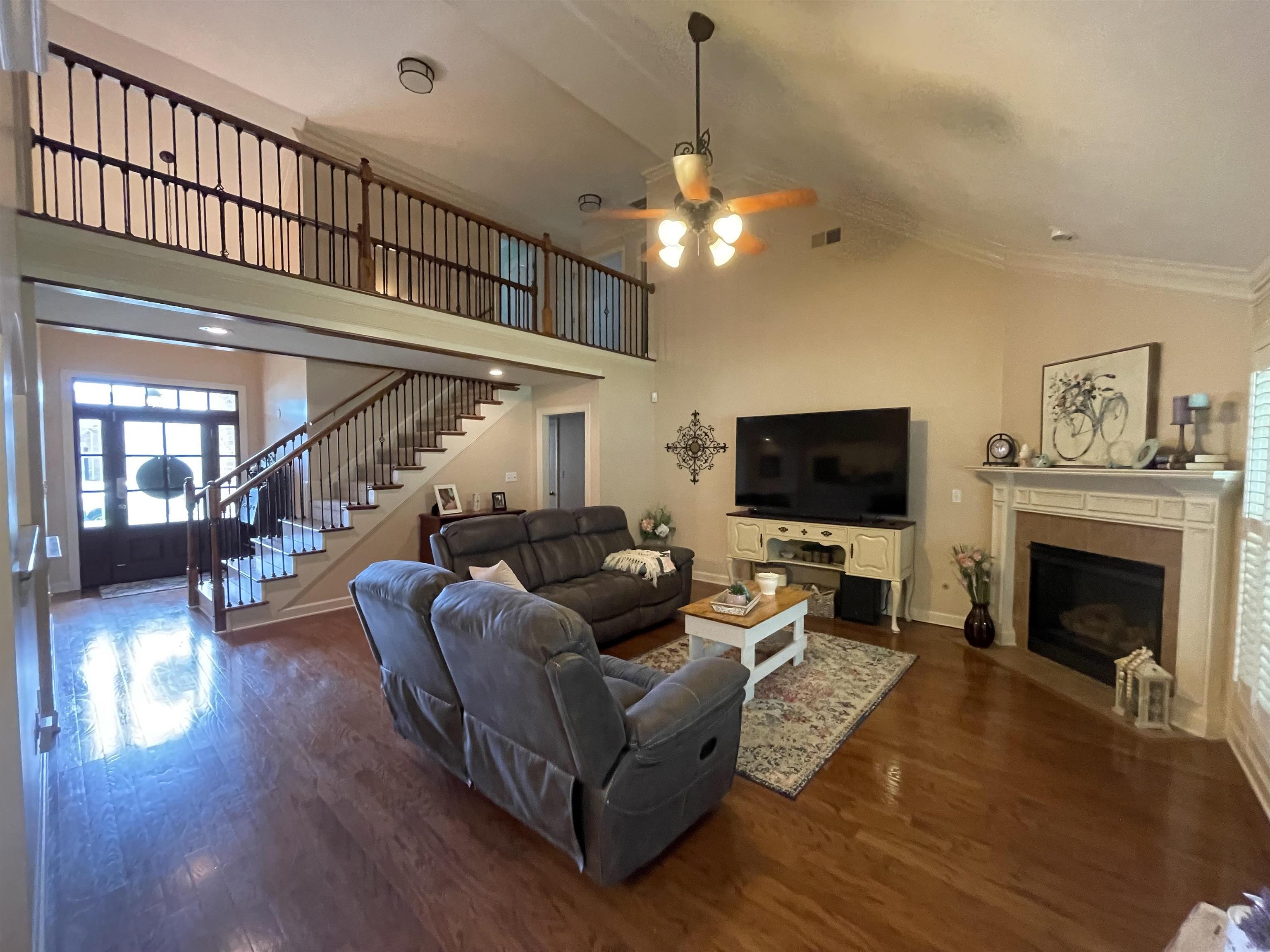 17 Flagstone Drive Jackson, TN 38305 - Photo 5 of 16 a living room with furniture a flat screen tv and a fireplace