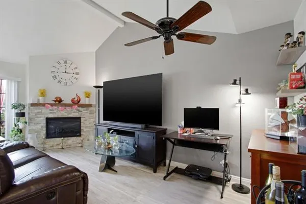 a living room with furniture and a flat screen tv