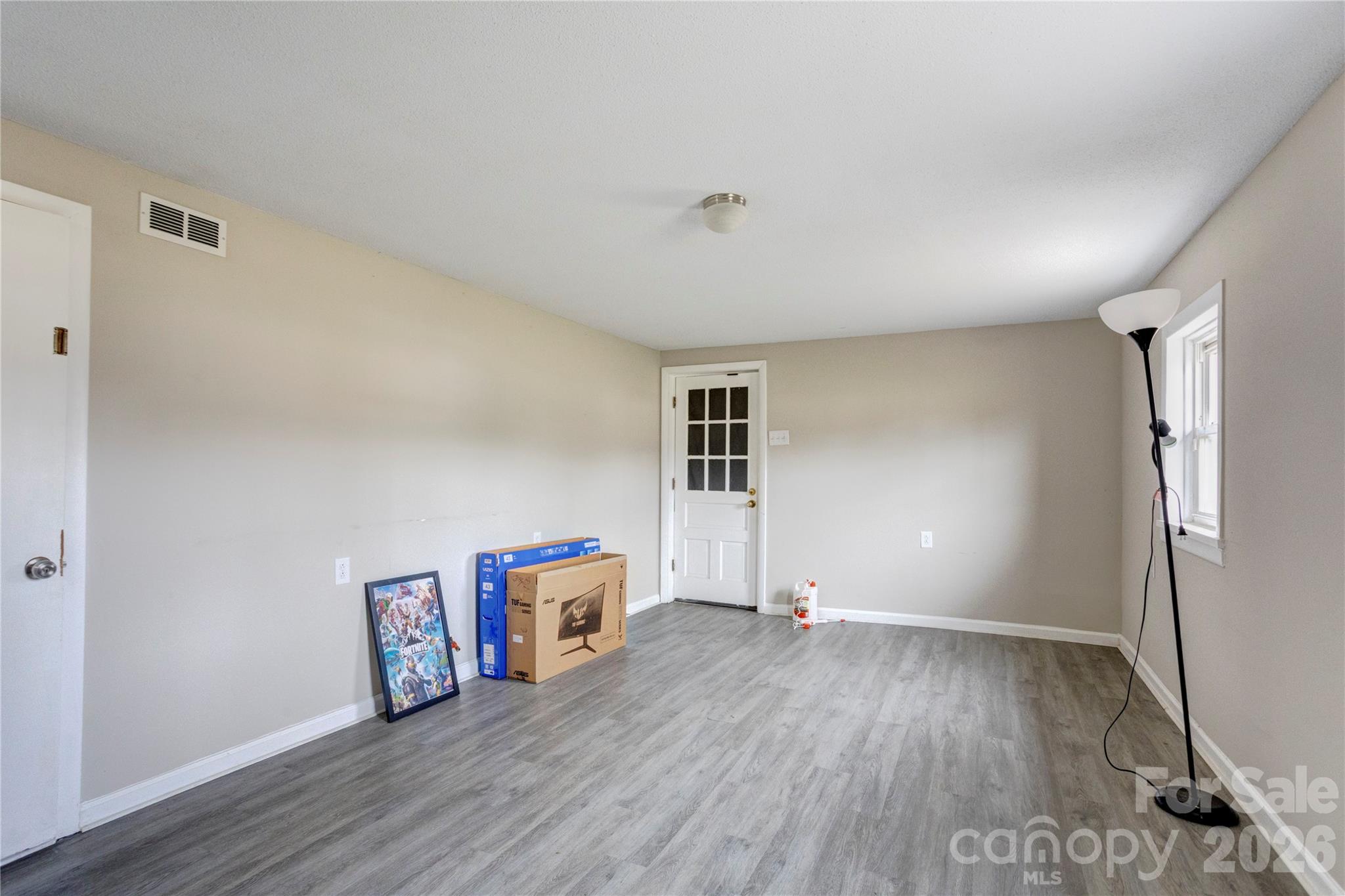 455 Rimer Road Salisbury, NC 28146 - Photo 13 of 22 a view of an empty room with wooden floor and a window