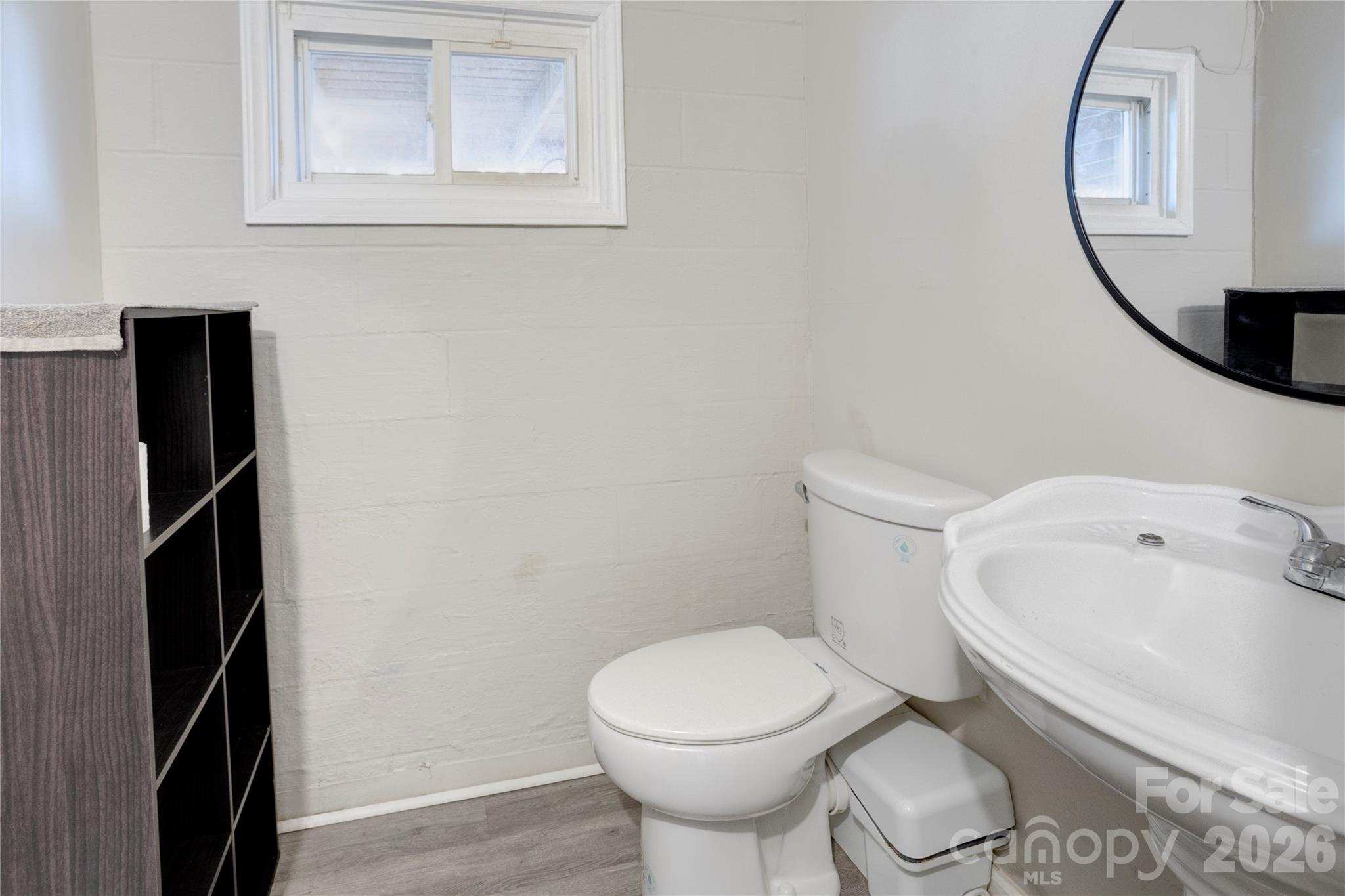 455 Rimer Road Salisbury, NC 28146 - Photo 16 of 22 a white toilet sitting next to a bathroom sink