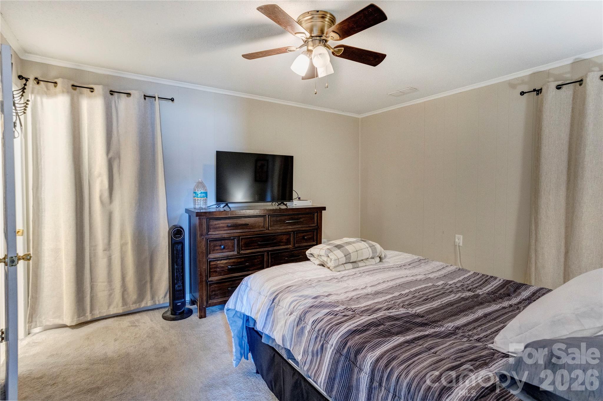 455 Rimer Road Salisbury, NC 28146 - Photo 7 of 22 a bedroom with a bed and a flat tv screen on dresser