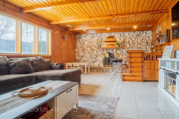 a living room with couches and a fireplace