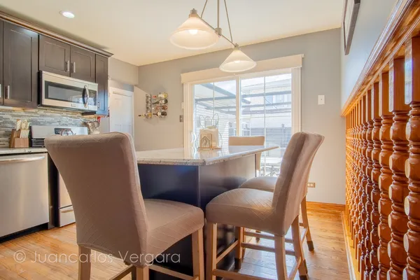 a view of kitchen island with furniture and flat screen tv