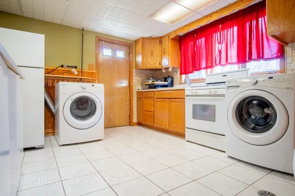 a kitchen with a sink and a stove top oven