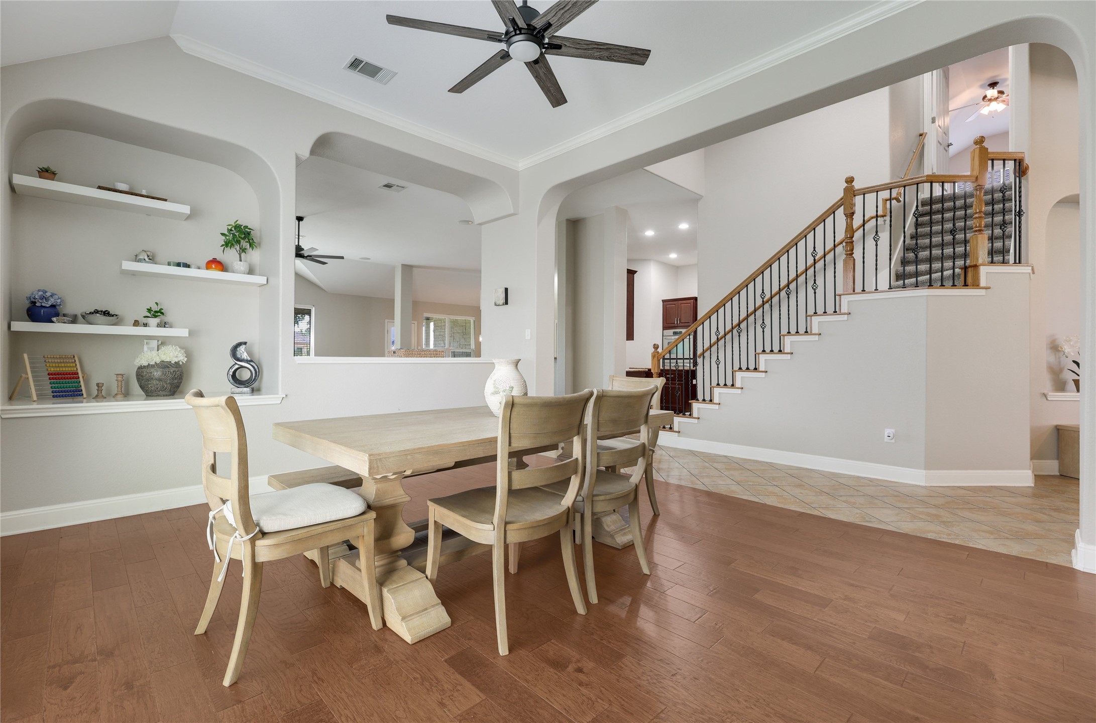 433 Ridgetop Bend Cedar Park, TX 78613 - Photo 11 of 34 Dining space featuring a ceiling fan, arched walkways, wood finished floors, and ornamental molding