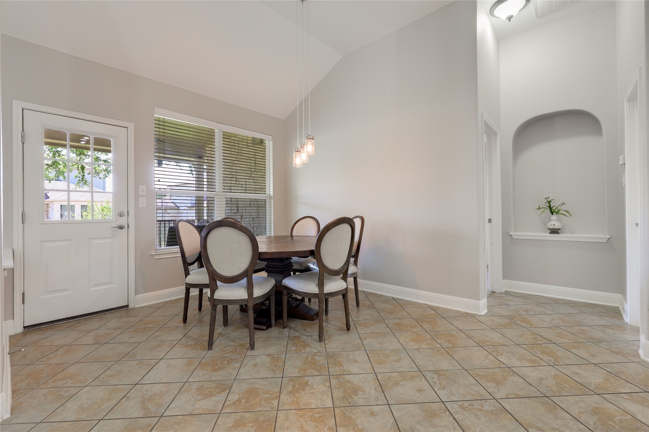 433 Ridgetop Bend Cedar Park, TX 78613 - Photo 16 of 34 Dining area with lofted ceiling and light tile patterned floors