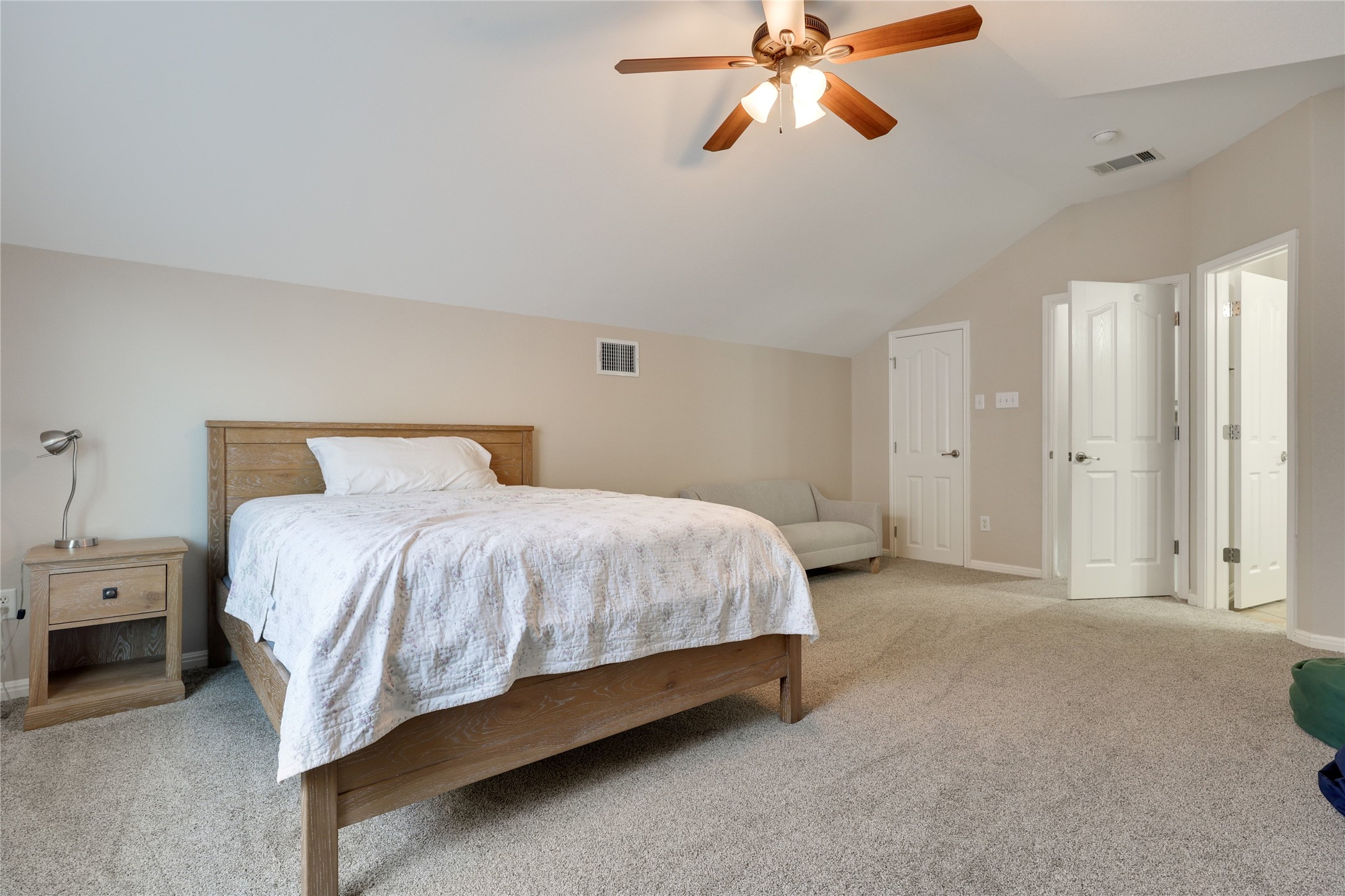 433 Ridgetop Bend Cedar Park, TX 78613 - Photo 18 of 34 Bedroom with light carpet, lofted ceiling, a ceiling fan, and a closet