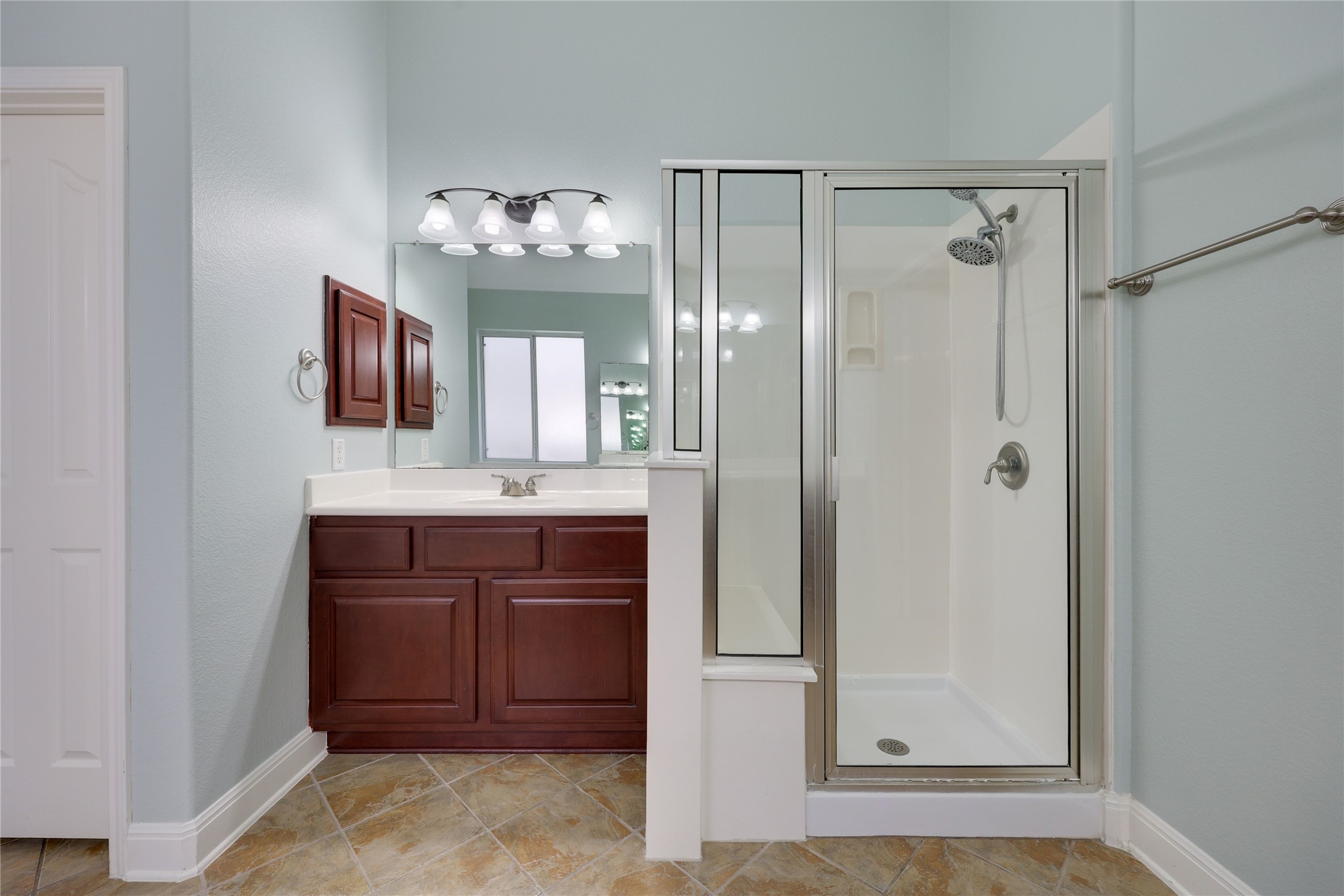 433 Ridgetop Bend Cedar Park, TX 78613 - Photo 22 of 34 Full bathroom with vanity, a stall shower, and light tile patterned floors