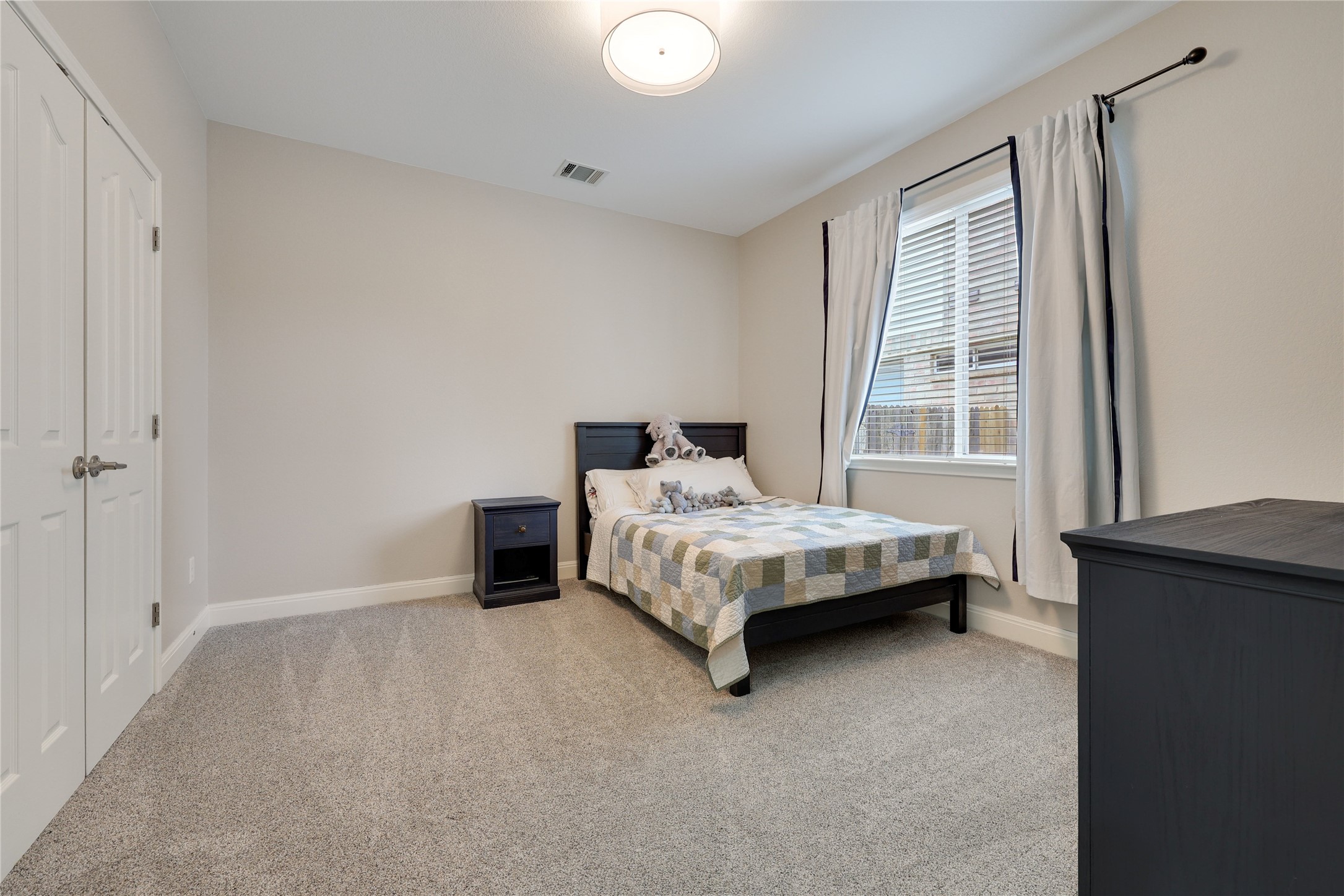 433 Ridgetop Bend Cedar Park, TX 78613 - Photo 30 of 34 Carpeted bedroom with baseboards and a closet