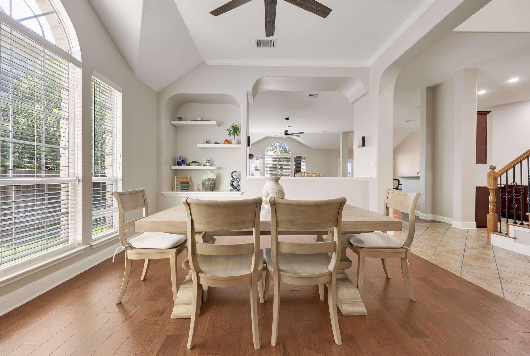 433 Ridgetop Bend Cedar Park, TX 78613 - Photo 10 of 34 Dining room featuring ceiling fan, light wood-style floors, vaulted ceiling, built in shelves, and ornamental molding