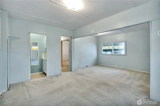 a view of an empty room with a window