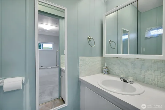 a bathroom with a sink and a mirror