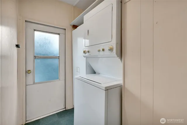 a view of a hallway with washer and dryer