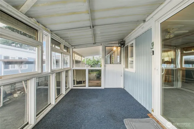 a view of empty room with windows