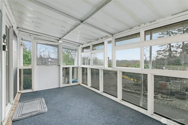 a view of an empty room with a balcony
