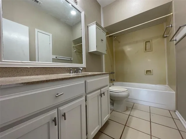a bathroom with a sink a toilet and a shower