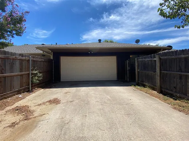 a view of a house with a tree
