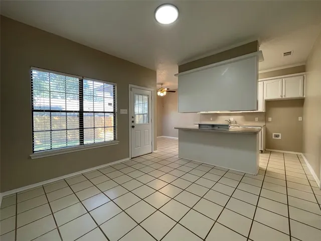 a kitchen with stainless steel appliances a sink and cabinets