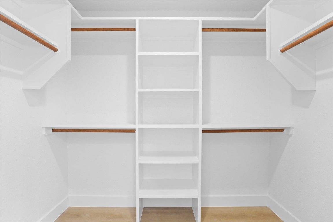 9229 Independence Loop Austin, TX 78748 - Photo 20 of 24 Primary walk in closet featuring custom shelving