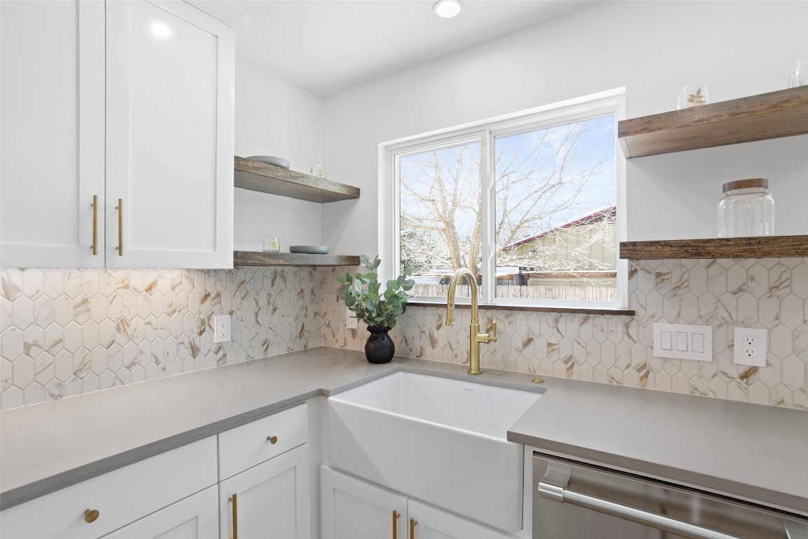 9229 Independence Loop Austin, TX 78748 - Photo 9 of 24 Kitchen featuring farmhouse sink and open shelving