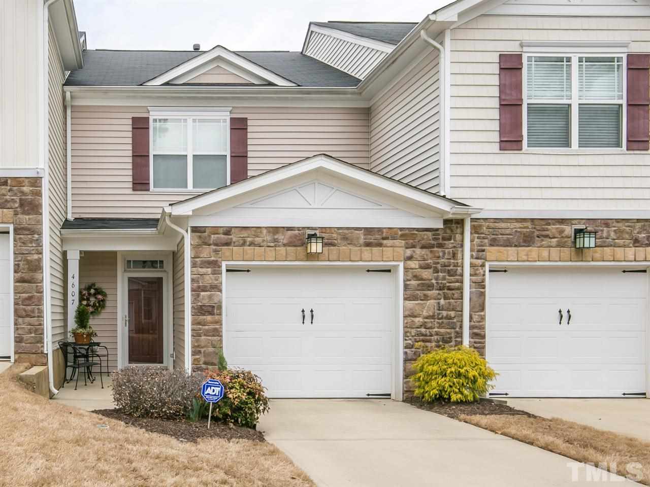 4607 Altha Street Raleigh, NC 27606 - Photo 1 of 23 a front view of a house with garden