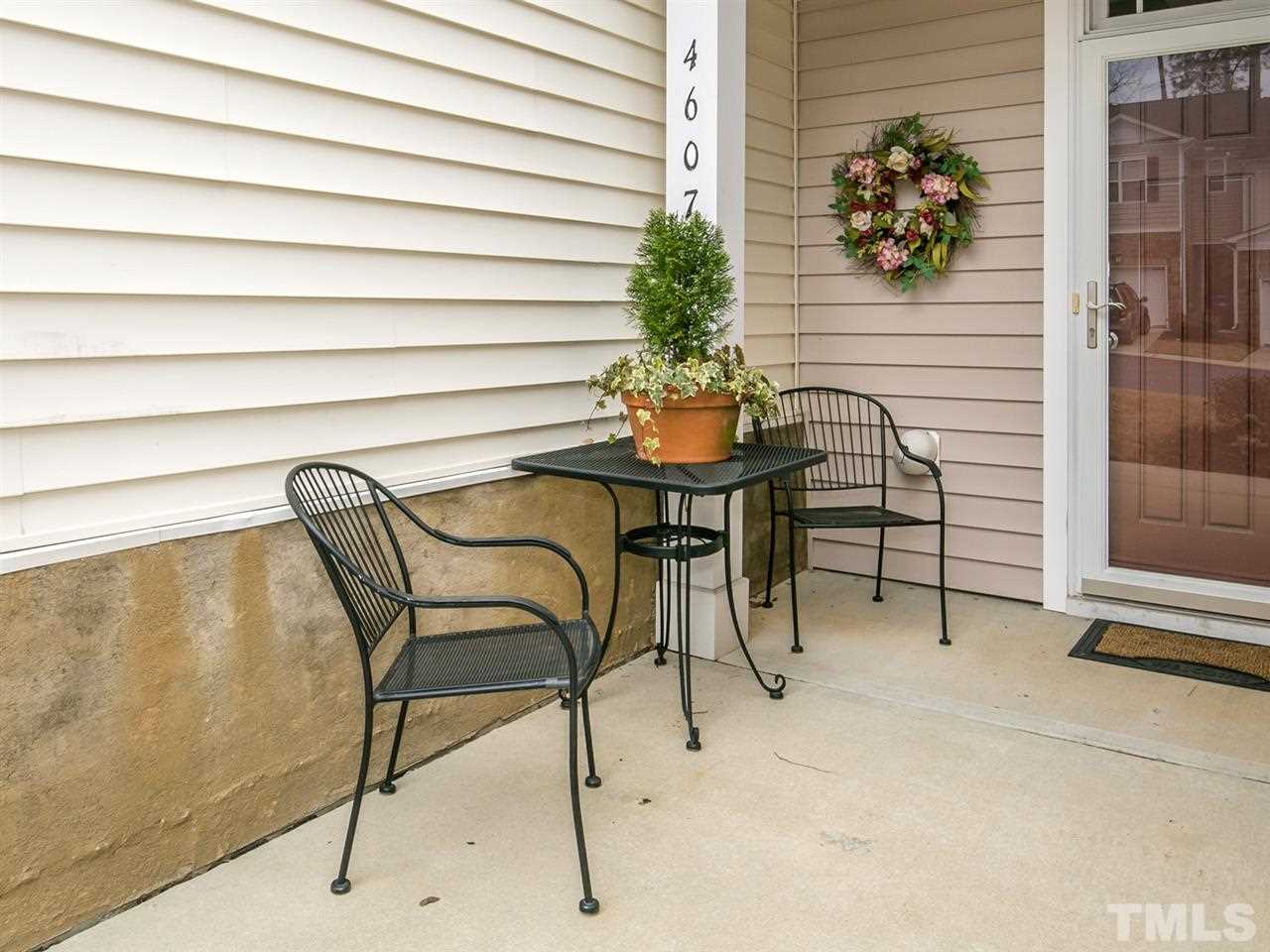 4607 Altha Street Raleigh, NC 27606 - Photo 11 of 23 a house with a table and a chair