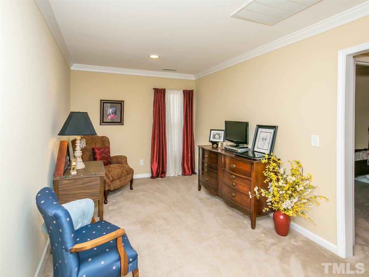 4607 Altha Street Raleigh, NC 27606 - Photo 14 of 23 a living room with furniture and a flat screen tv