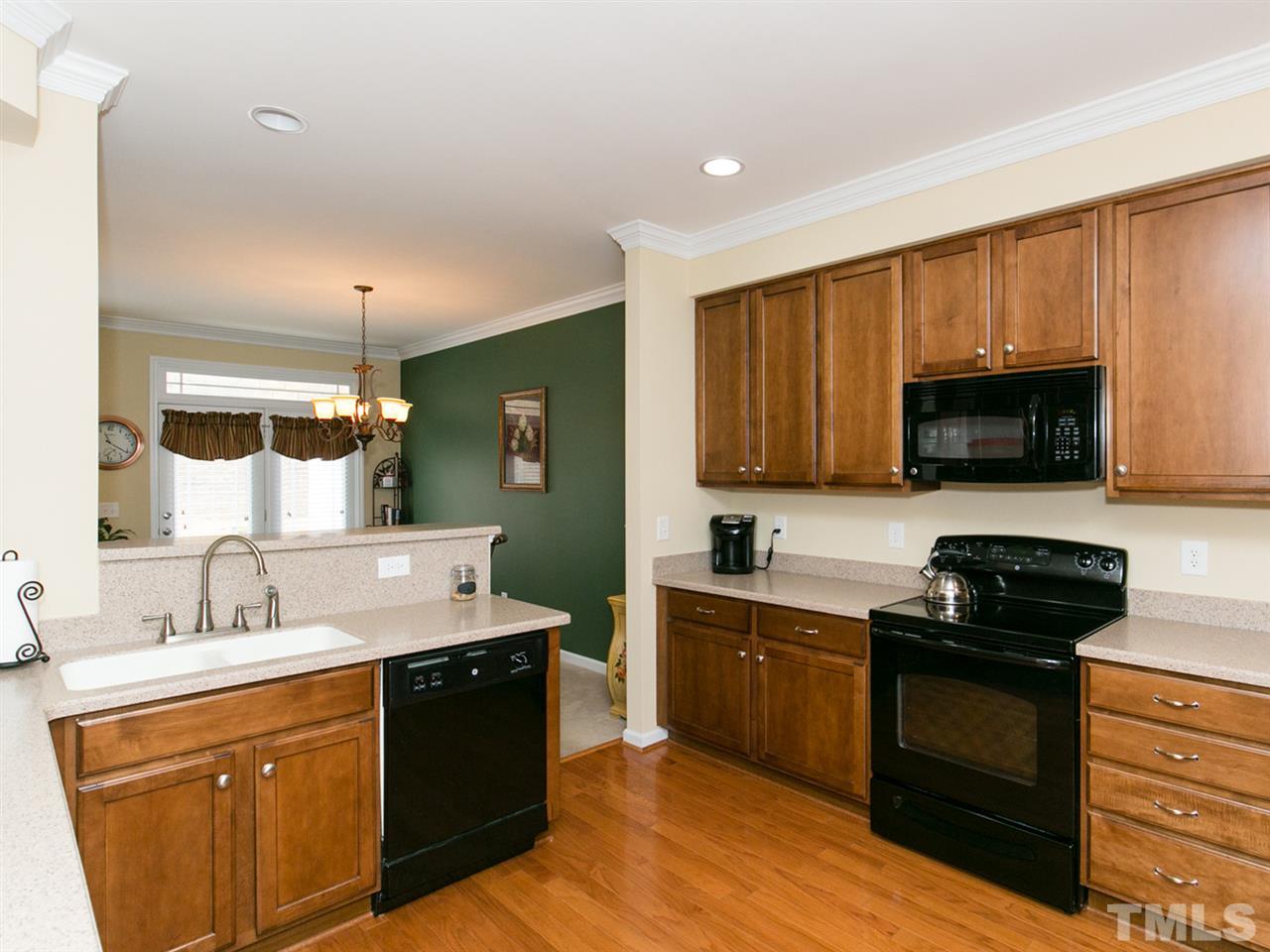4607 Altha Street Raleigh, NC 27606 - Photo 9 of 23 a kitchen with a sink stove and microwave