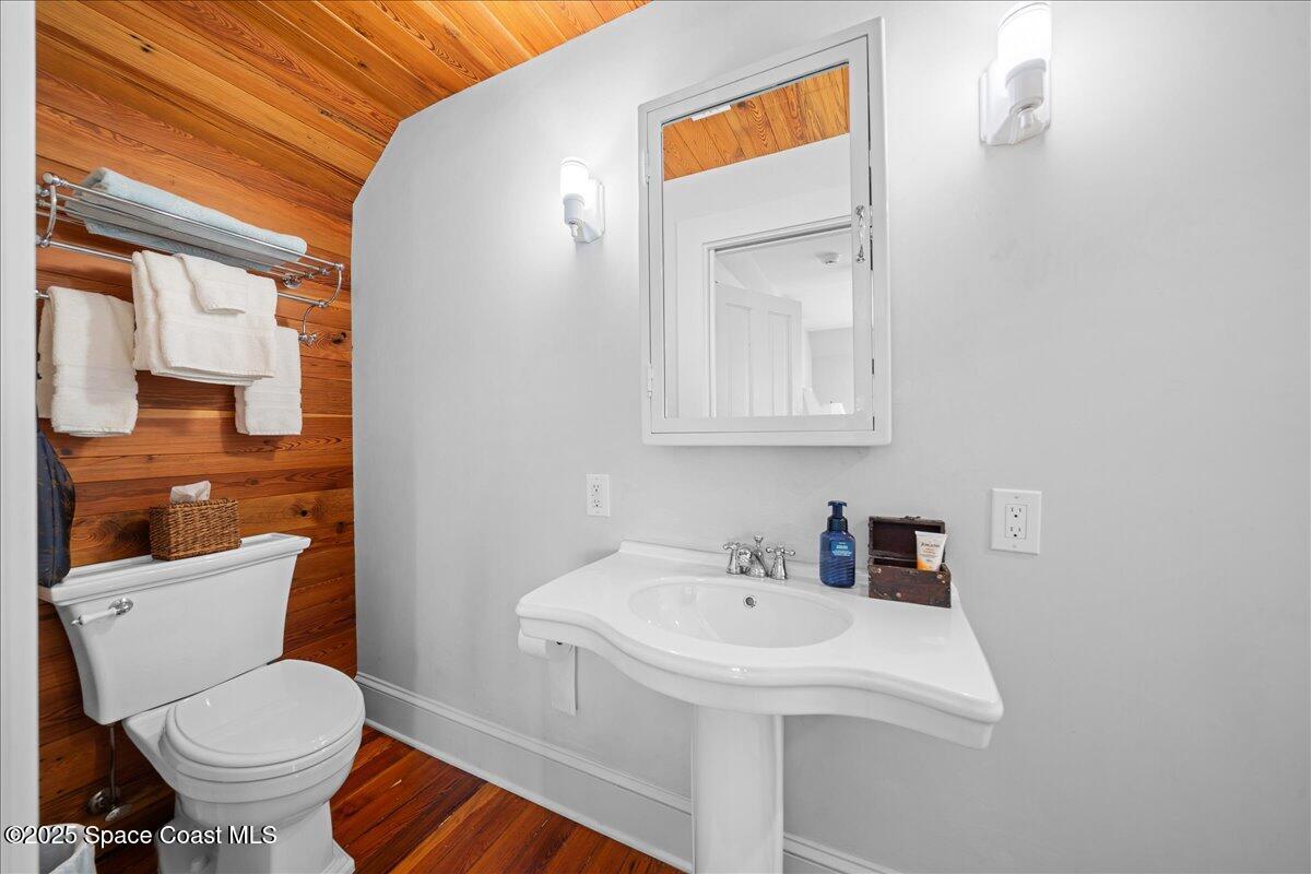 11 Mitchell Street Cocoa, FL 32922 - Photo 89 of 132 a bathroom with a sink a toilet and mirror