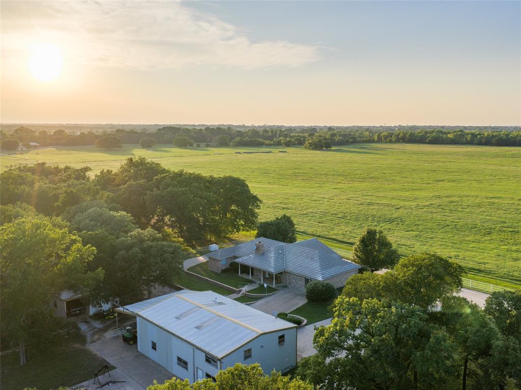 449 Private Road 4670 Rhome, TX 76078 - Photo 4 of 39 an aerial view of ocean with residential house with outdoor space and trees