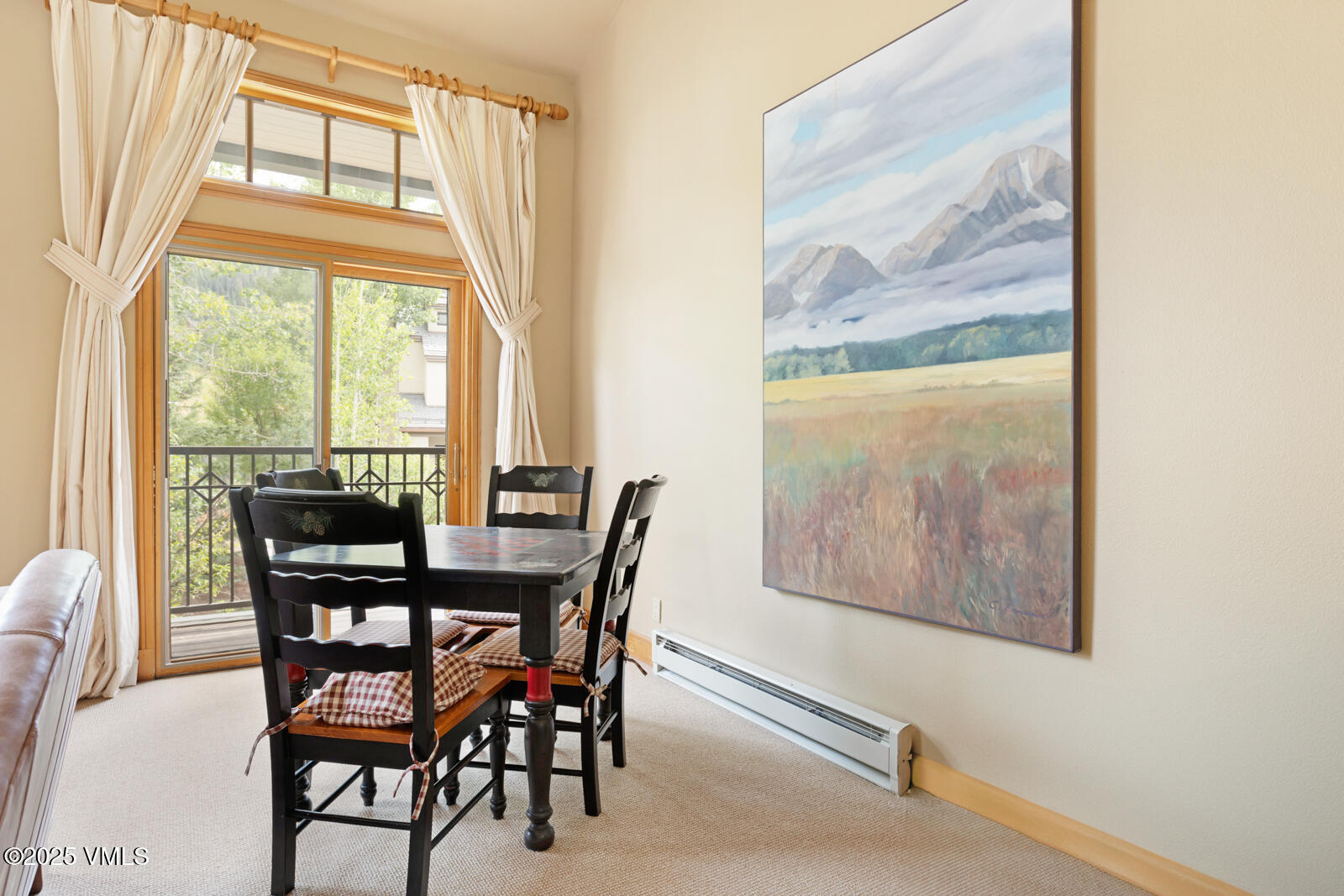380 Offerson Road, Unit K2 Beaver Creek, CO 81620 - Photo 13 of 40 a view of a dining room with furniture a chandelier and wooden floor