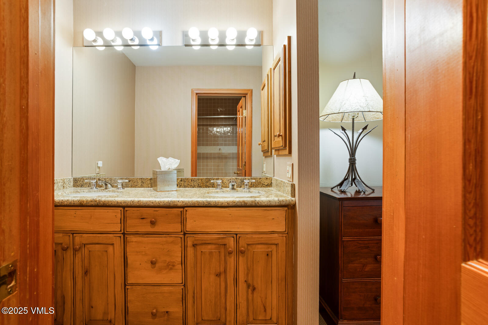 380 Offerson Road, Unit K2 Beaver Creek, CO 81620 - Photo 17 of 40 a bathroom with a granite countertop sink and a mirror