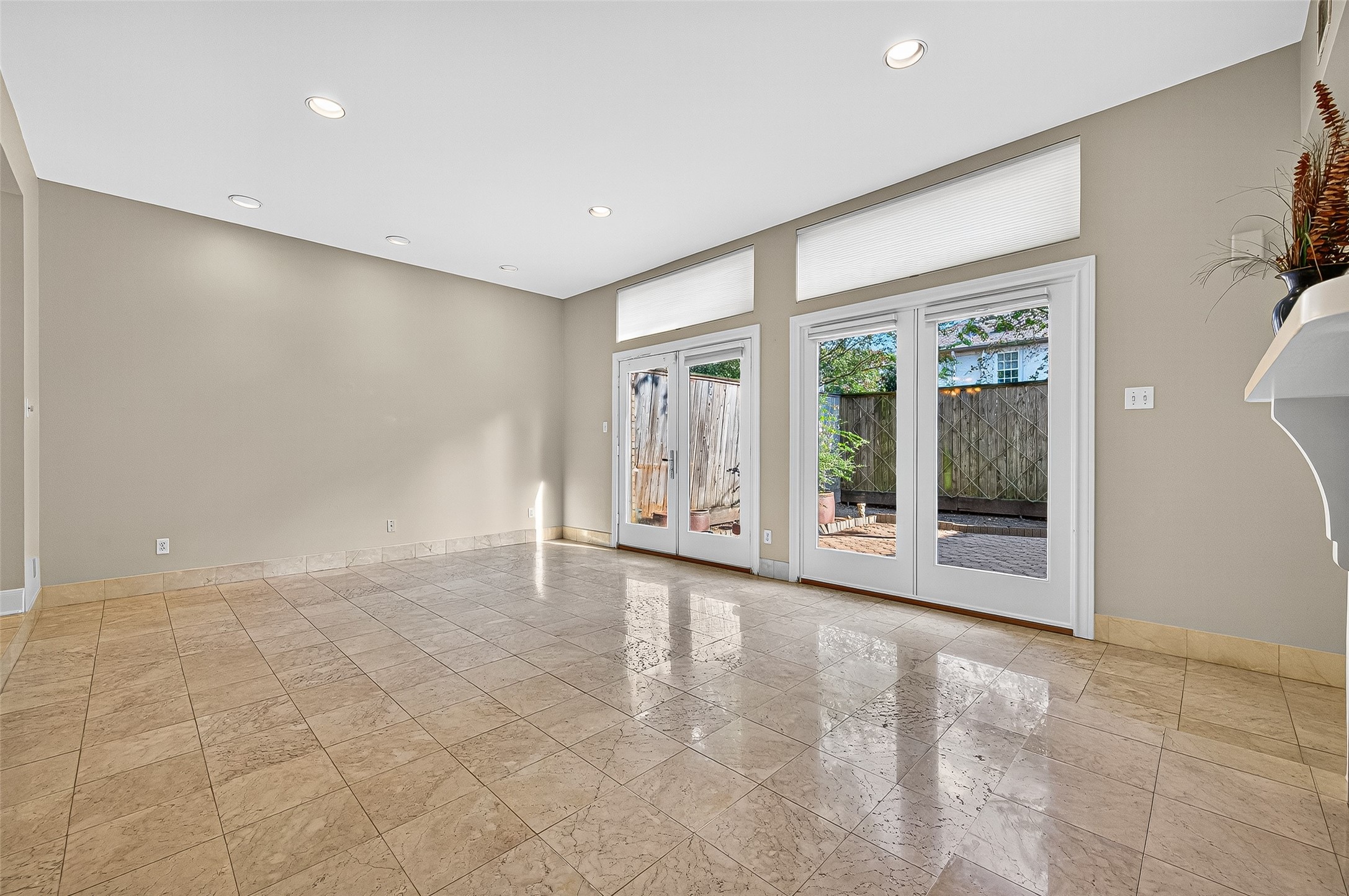 3027 Bissonnet Street Houston, TX 77005 - Photo 13 of 47 Walls of windows keep the main level bright and open throughout the day